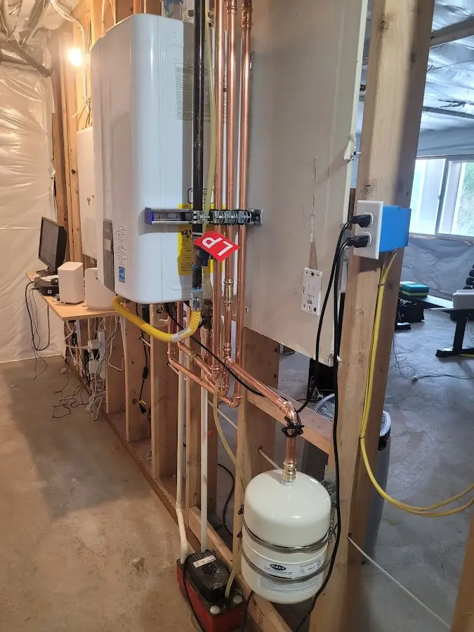 Licensed plumber repairing a kitchen sink in Newcastle